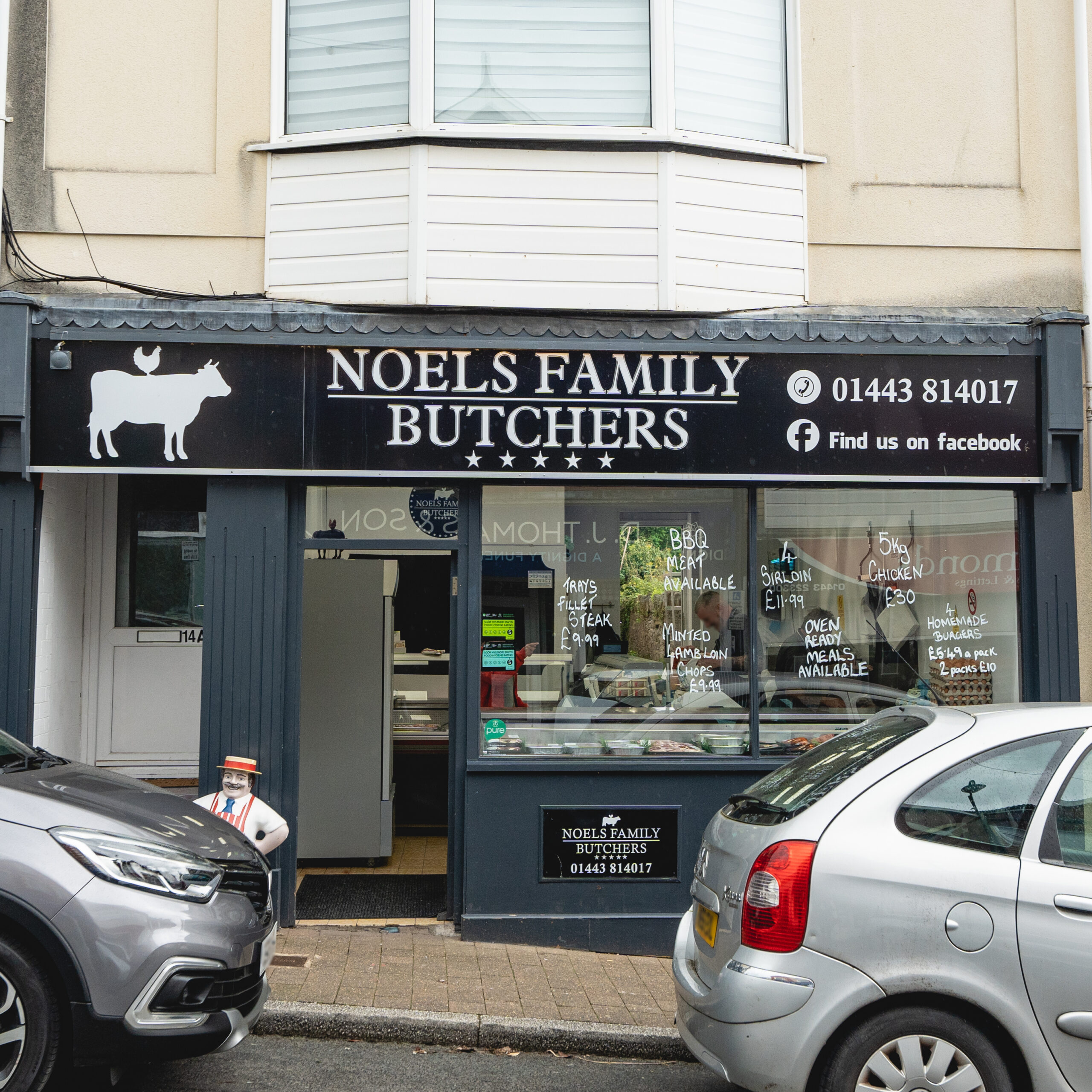 The slate-blue shopfront of Noels Family Butchers at 14 Bedwlwyn Road, Ystrad Mynach